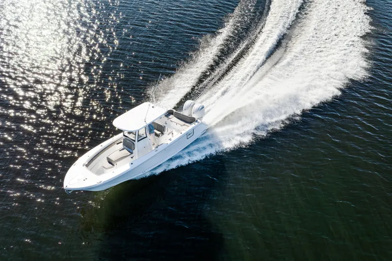 Slide: The Image of 2026 Sea Hunt Ultra 275 Coffin Box cruising on sparkling water. - 1