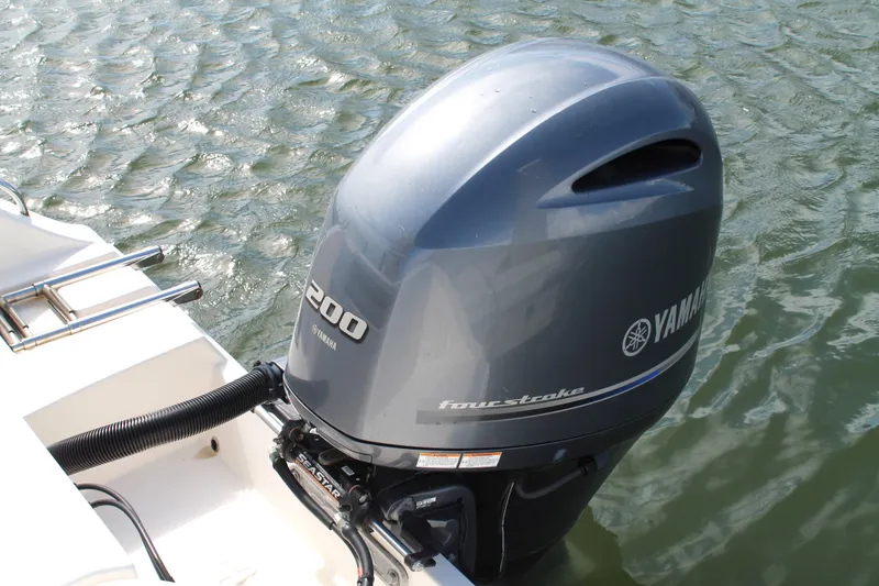Slide: The Image of Yamaha 200 horsepower outboard motor on 2018 Cobia 220 Center Console boat. - 12