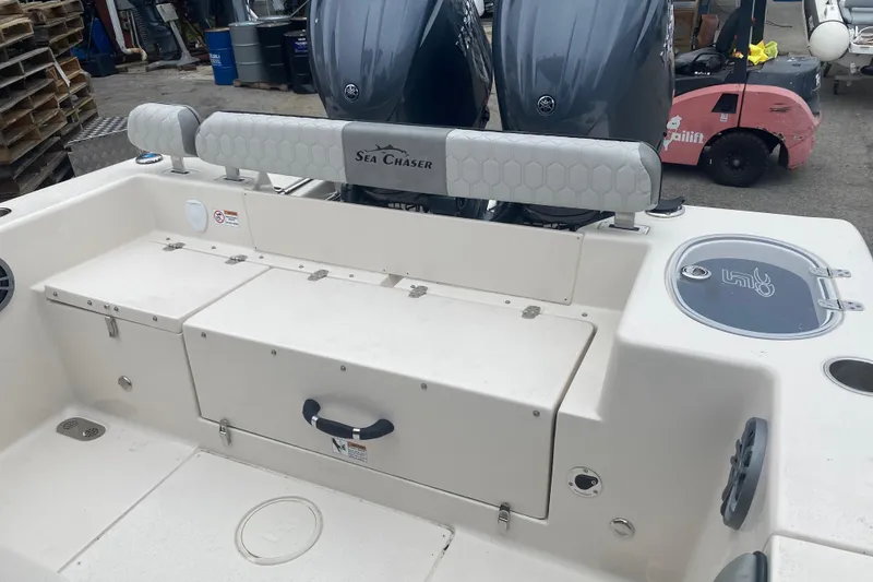 Slide: The Image of 2026 Sea Chaser 24 HFC boat interior with dual engines and storage compartments. - 13