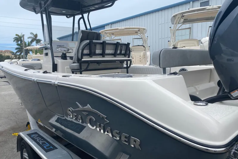 Slide: The Image of 2026 Sea Chaser 24 HFC boat on trailer, showcasing sleek design and modern features. - 3
