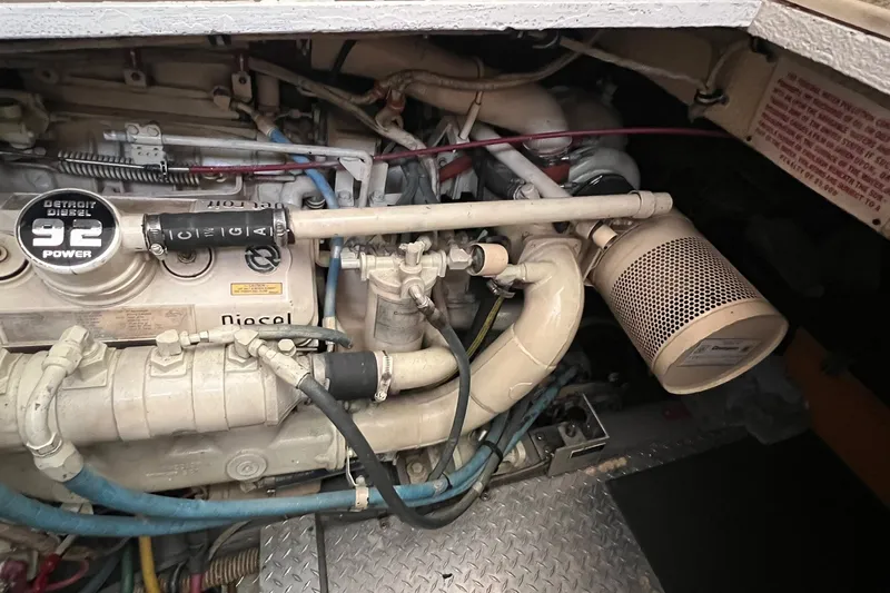 Slide: The Image of Engine compartment of a 1990 Hatteras 41 Convertible with Detroit Diesel components. - 28