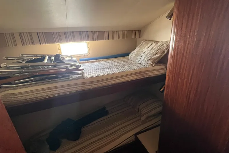 Slide: The Image of Interior cabin of 1990 Hatteras 41 Convertible with bunk beds and window. - 11
