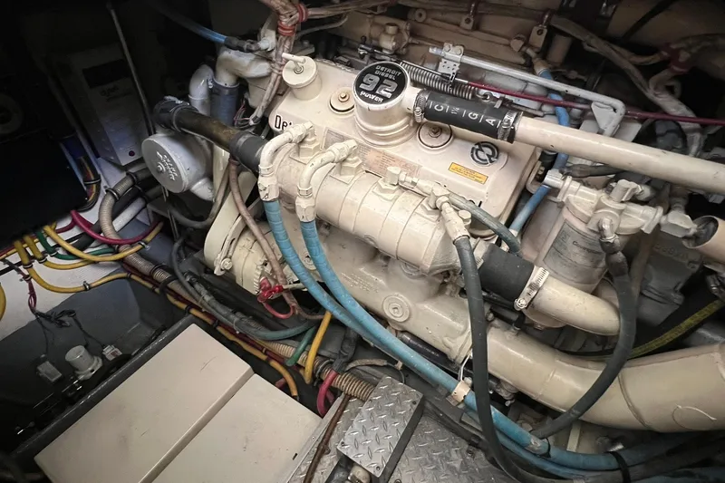 Slide: The Image of Engine compartment of a 1990 Hatteras 41 Convertible boat, showcasing wiring and components. - 29