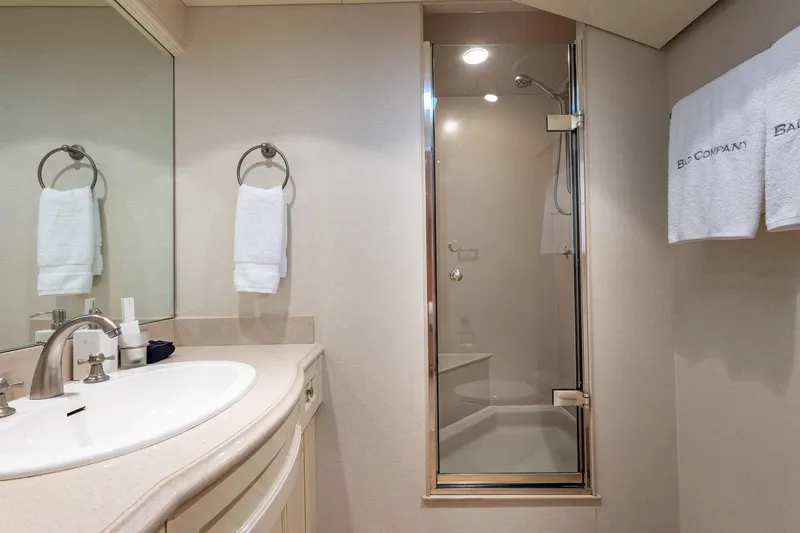 Slide: The Image of Luxurious bathroom on 1998 Trinity Yachts model, featuring elegant sink and shower. - 42