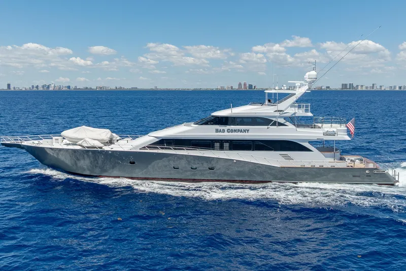 Slide: The Image of Luxurious 1998 Trinity Yachts model cruising on open blue sea under clear skies. - 2