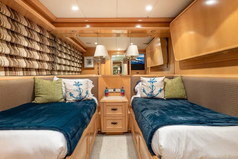 Slide: The Image of Luxurious twin cabin interior on 1998 Trinity Yachts, featuring nautical-themed decor. - 36