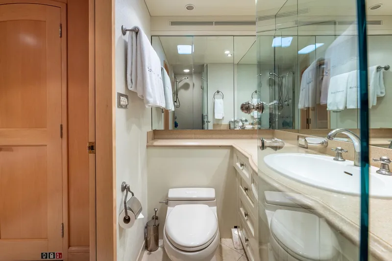Slide: The Image of Luxurious yacht bathroom with modern fixtures, mirrors, and elegant wooden accents, Trinity Yachts 1998. - 35