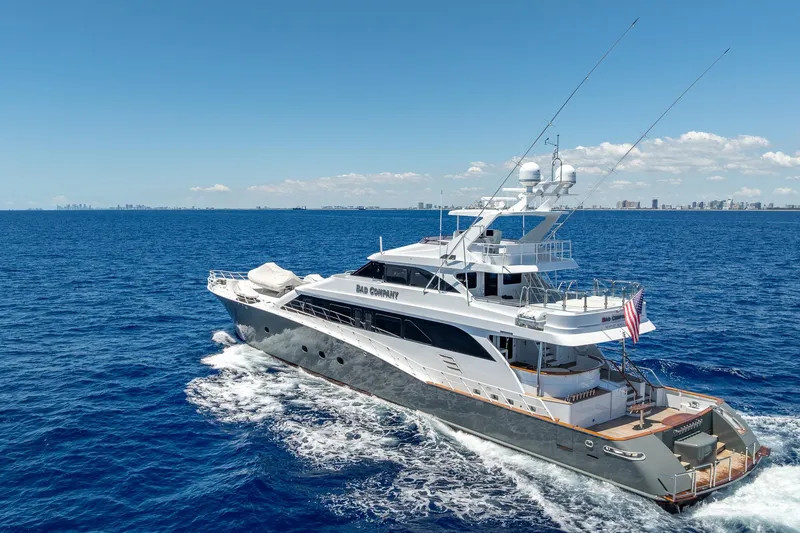 Slide: The Image of Luxurious 1998 Trinity Yachts vessel cruising on open blue ocean under clear skies. - 3
