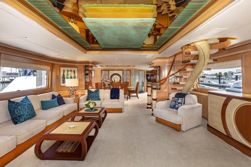 Slide: The Image of Luxurious interior of a 1998 Trinity Yachts model, featuring elegant seating and modern decor. - 13