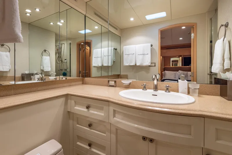 Slide: The Image of Luxurious bathroom on 1998 Trinity Yachts, featuring elegant fixtures and mirrored cabinetry. - 34