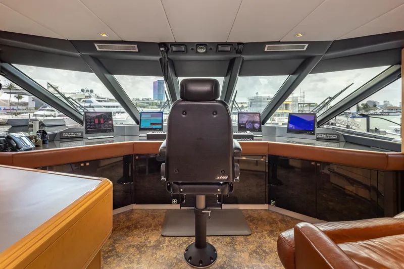 Slide: The Image of Luxurious 1998 Trinity Yachts helm with panoramic windows and advanced navigation equipment. - 48