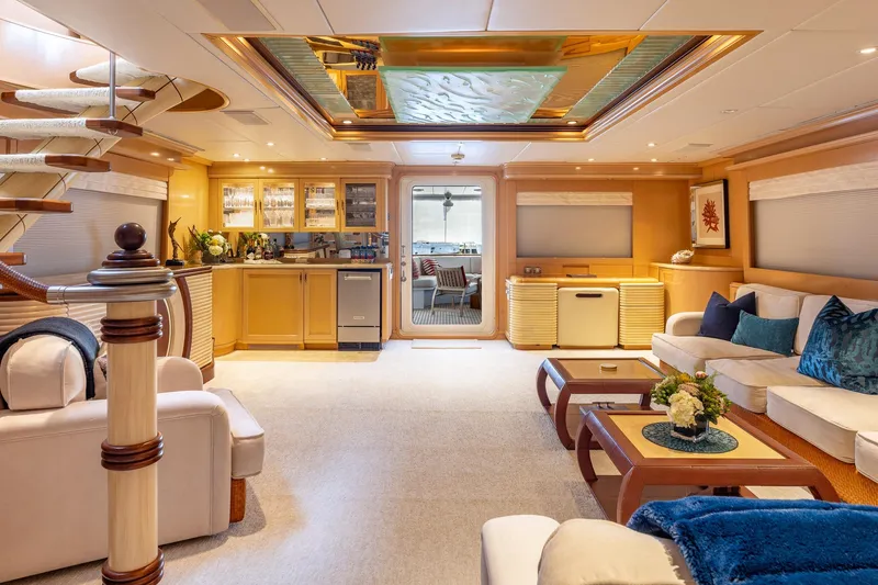 Slide: The Image of Luxurious 1998 Trinity Yachts interior with elegant seating, bar area, and modern decor. - 16