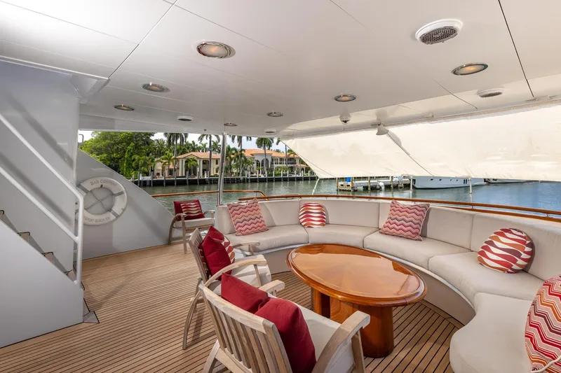 Slide: The Image of Luxurious 1998 Trinity Yachts deck with elegant seating and waterfront view. - 11