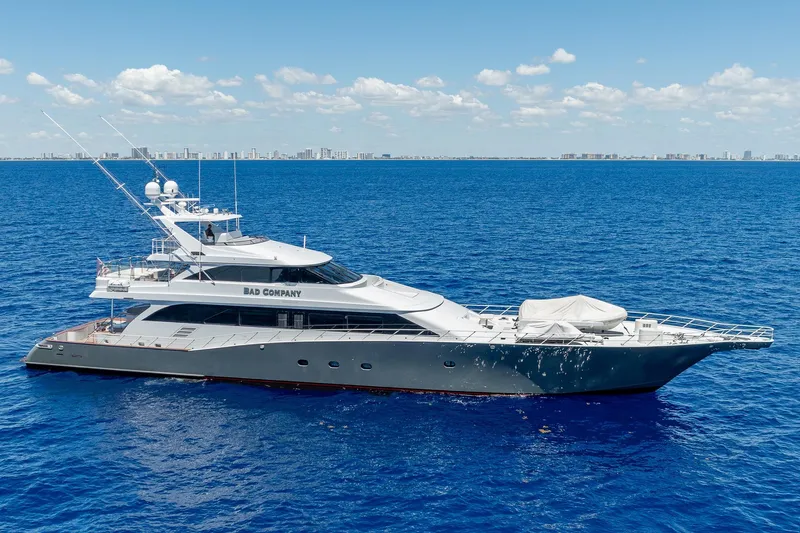 Slide: The Image of Luxurious 1998 Trinity Yachts vessel cruising on open blue sea under clear skies. - 0