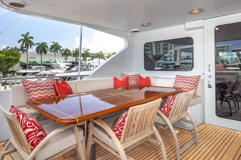 Slide: The Image of Luxurious 1998 Trinity Yachts deck with elegant dining area and vibrant cushions. - 52