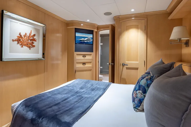 Slide: The Image of Luxurious 1998 Trinity Yachts cabin with elegant wood paneling and nautical decor. - 44