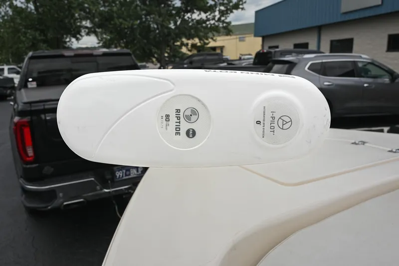 Slide: The Image of Minn Kota Riptide trolling motor on 2021 Pathfinder 2200 TRS boat, parked in lot. - 53