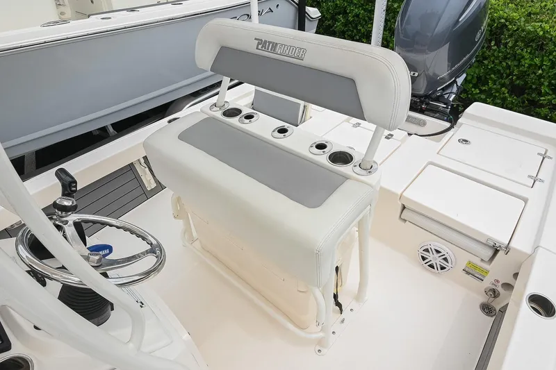 Slide: The Image of 2021 Pathfinder 2200 TRS boat interior with steering wheel and seating area. - 35