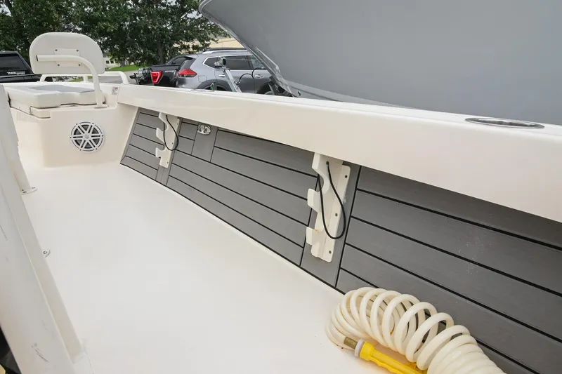 Slide: The Image of Interior view of a 2021 Pathfinder 2200 TRS boat, featuring seating and storage compartments. - 40