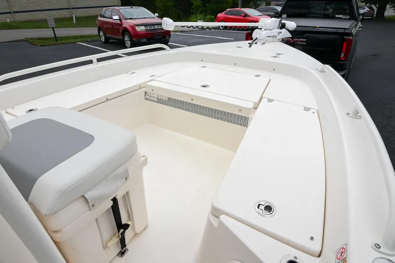 Slide: The Image of 2021 Pathfinder 2200 TRS boat interior with seating and storage compartments. - 48