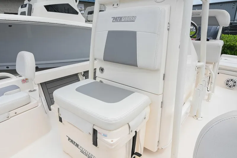 Slide: The Image of 2021 Pathfinder 2200 TRS boat interior with cushioned seating and storage. - 43