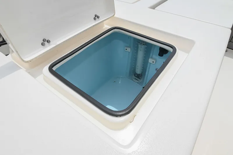 Slide: The Image of Open storage compartment on 2021 Pathfinder 2200 TRS boat. - 22