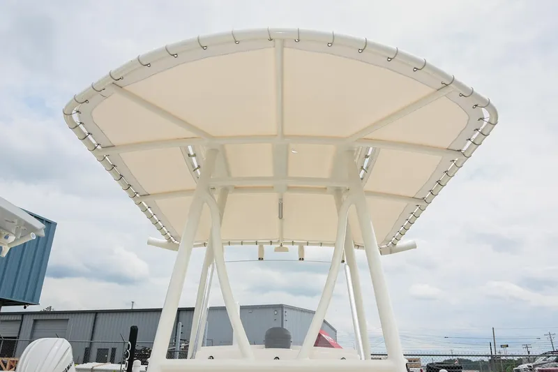 Slide: The Image of 2021 Pathfinder 2200 TRS boat T-top canopy against cloudy sky. - 38