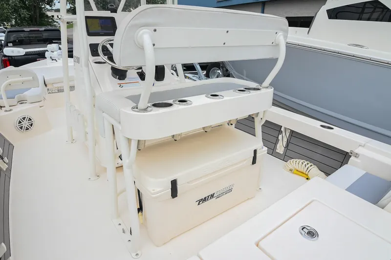Slide: The Image of 2021 Pathfinder 2200 TRS boat interior with seating and storage features. - 25