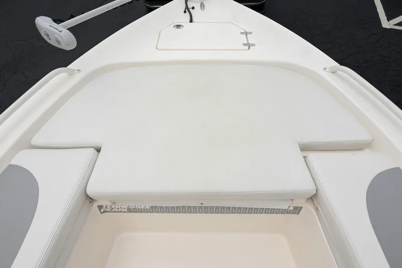 Slide: The Image of 2021 Pathfinder 2200 TRS boat deck with cushioned seating and storage compartment. - 46