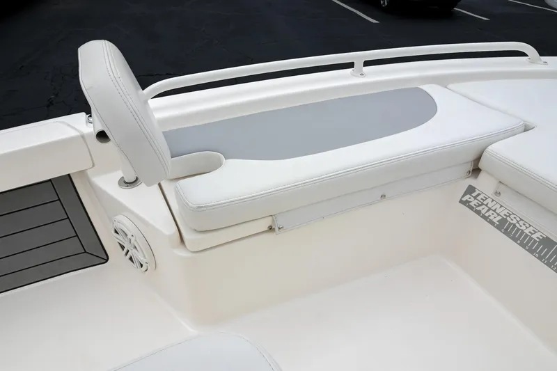 Slide: The Image of 2021 Pathfinder 2200 TRS boat interior with cushioned seating and speaker. - 45