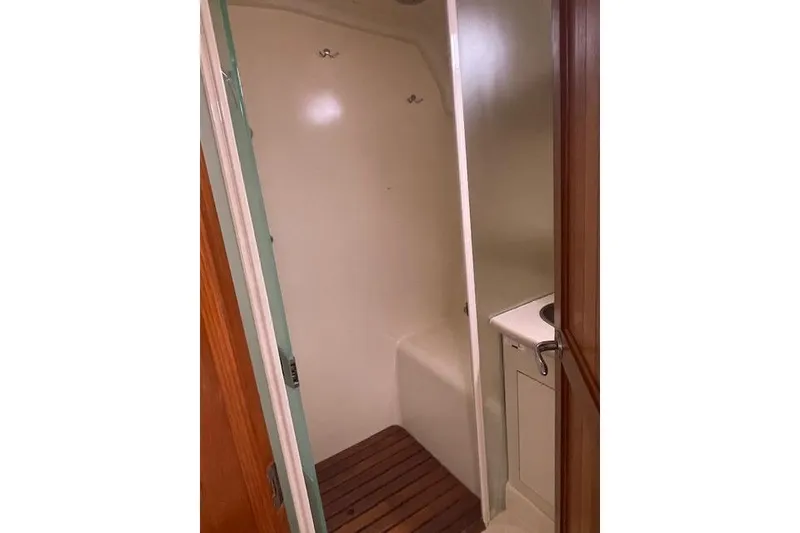 Slide: The Image of Shower area in 2007 Hunter 45 Center Cockpit yacht with wooden floor. - 16