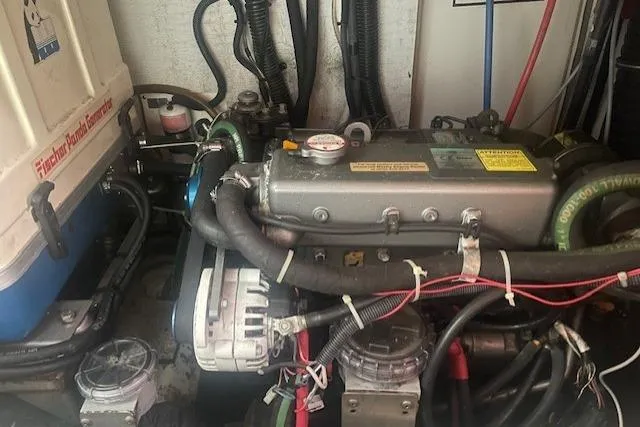 Slide: The Image of Engine compartment of a 2007 Hunter 45 Center Cockpit sailboat, showcasing mechanical components. - 6
