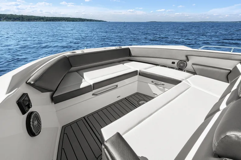 Slide: The Image of Luxurious seating area on 2020 Cruisers Yachts 38 GLS OB, overlooking serene blue waters. - 9