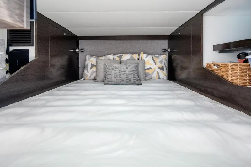 Slide: The Image of Luxurious cabin interior of 2020 Cruisers Yachts 38 GLS OB with cozy bedding. - 18