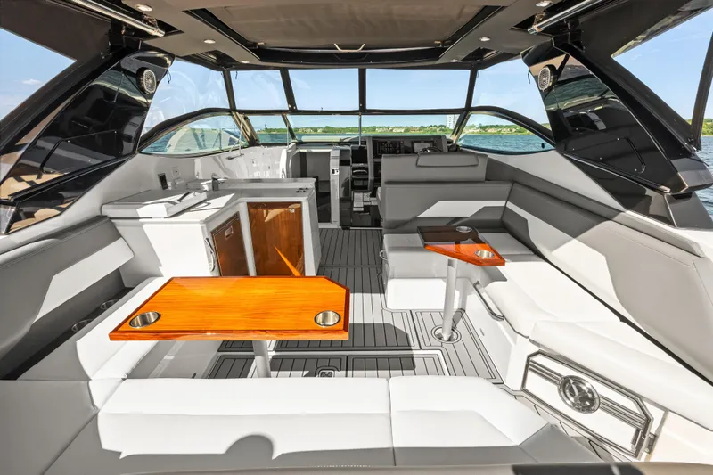 Slide: The Image of Luxurious interior of 2020 Cruisers Yachts 38 GLS OB with modern seating and tables. - 15
