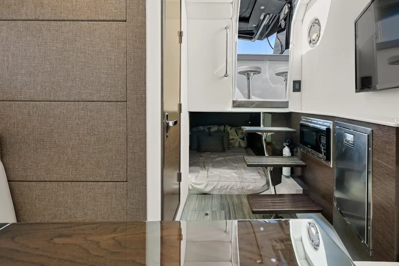Slide: The Image of Interior of 2020 Cruisers Yachts 38 GLS OB, featuring modern cabin amenities and sleek design. - 19