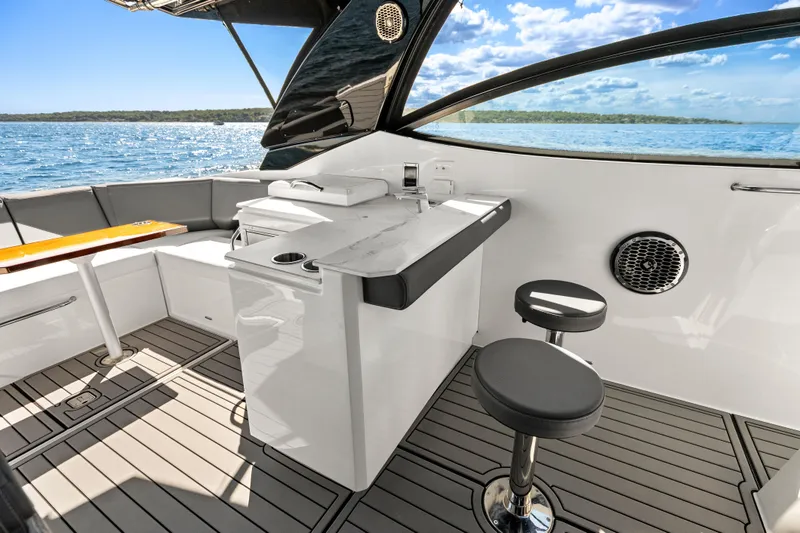 Slide: The Image of Luxurious 2020 Cruisers Yachts 38 GLS OB interior with seating and ocean view. - 11