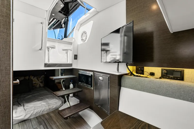 Slide: The Image of Interior of 2020 Cruisers Yachts 38 GLS OB, featuring modern amenities and sleek design. - 16