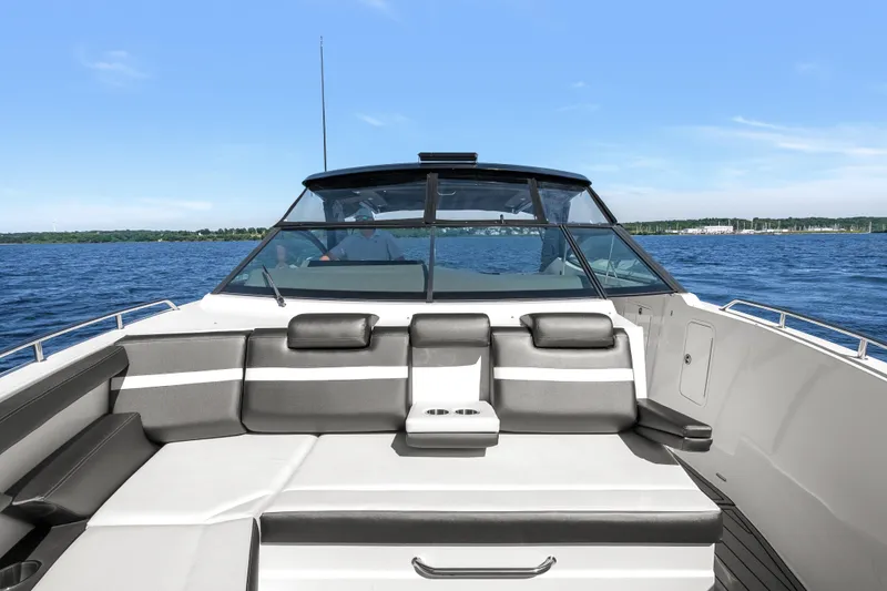 Slide: The Image of 2020 Cruisers Yachts 38 GLS OB on open water, featuring spacious seating and sleek design. - 8