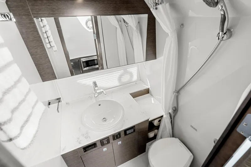 Slide: The Image of Luxurious bathroom in 2020 Cruisers Yachts 38 GLS OB with modern fixtures and elegant design. - 20