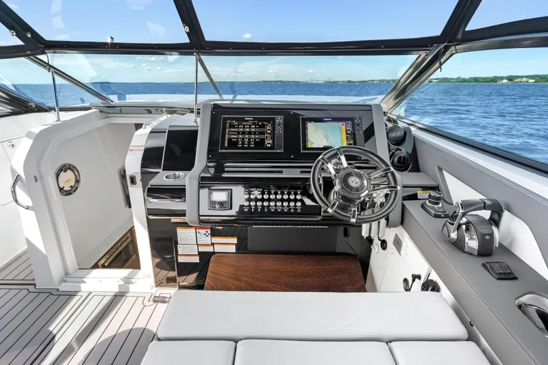 Slide: The Image of Cockpit of 2020 Cruisers Yachts 38 GLS OB with advanced navigation system and steering wheel. - 6