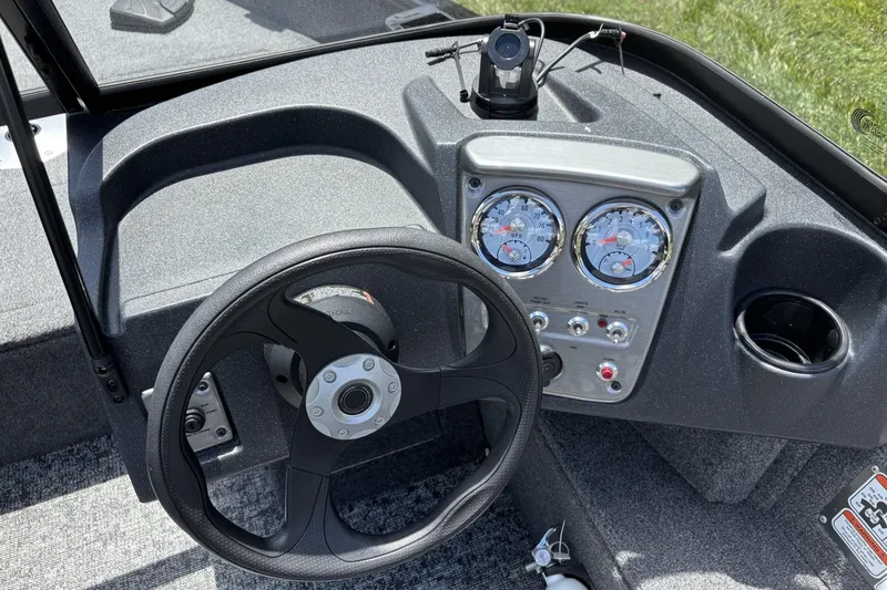 Slide: The Image of Steering console of 2025 Tracker Pro Guide V-16 WT boat with gauges and controls. - 15