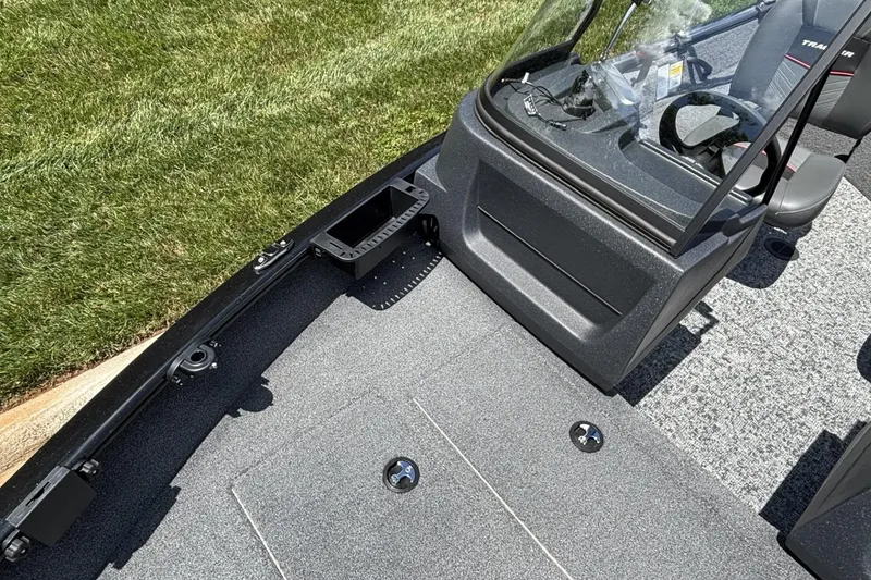 Slide: The Image of 2025 Tracker Pro Guide V-16 WT boat interior with seating and steering console. - 7