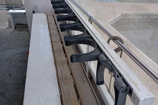 Slide: The Image of Rod holders on a 1980 Thompson Passenger and Dive Trawler deck. - 15