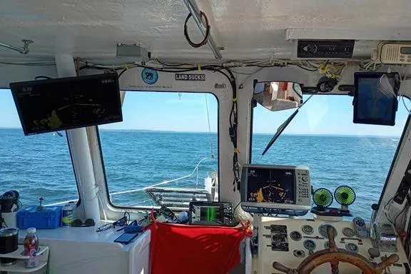 Slide: The Image of Cockpit view of 1980 Thompson Passenger and Dive Trawler with navigation equipment and ocean scenery. - 3