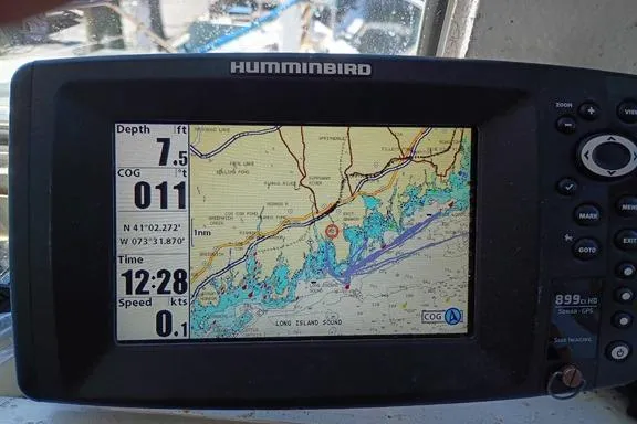 Slide: The Image of Humminbird GPS display on 1980 Thompson Passenger and Dive Trawler, showing navigation data and map. - 6