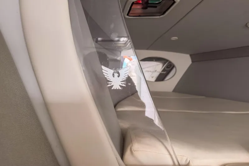Slide: The Image of Interior of a 2002 Formula 382 FASTech boat, featuring sleek design and emblem. - 10