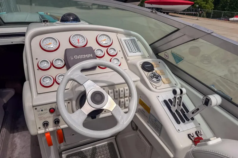 Slide: The Image of Cockpit of 2002 Formula 382 FASTech boat with Garmin navigation and control panel. - 13