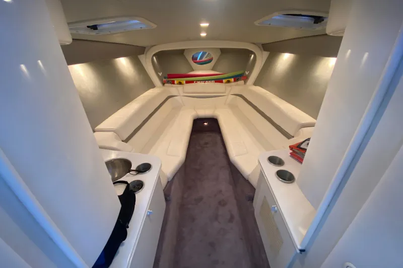 Slide: The Image of Interior of 2002 Formula 382 FASTech boat with white seating and modern design. - 19