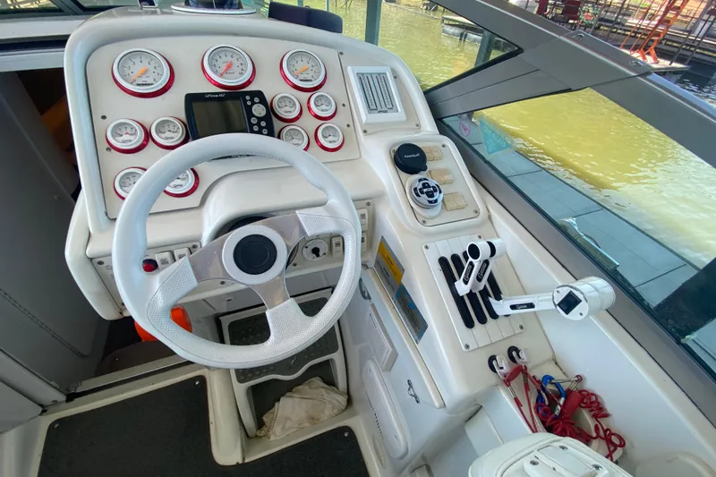 Slide: The Image of Cockpit of 2002 Formula 382 FASTech boat with steering wheel and control panel. - 21
